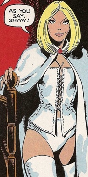 Emma Frost as she first appears. She is white and blonde. She is wearing white thigh-high heeled boots, a white corset and a white fur cloak. Speech bubble reads: 'As you say, Shaw'.